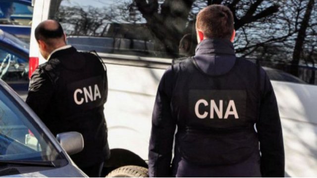 Ofițerii CNA au descins la Agenția Servicii Publice într-un dosar de corupție